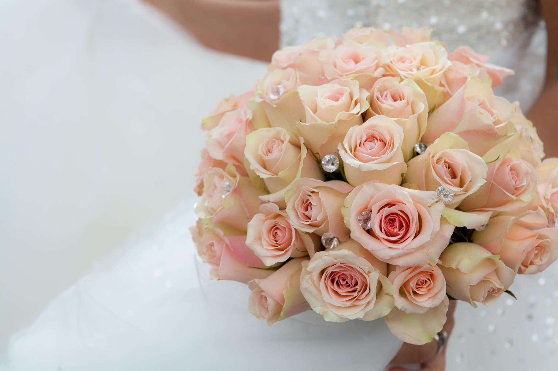 A beautiful bridal bouquet of white roses and flowers
