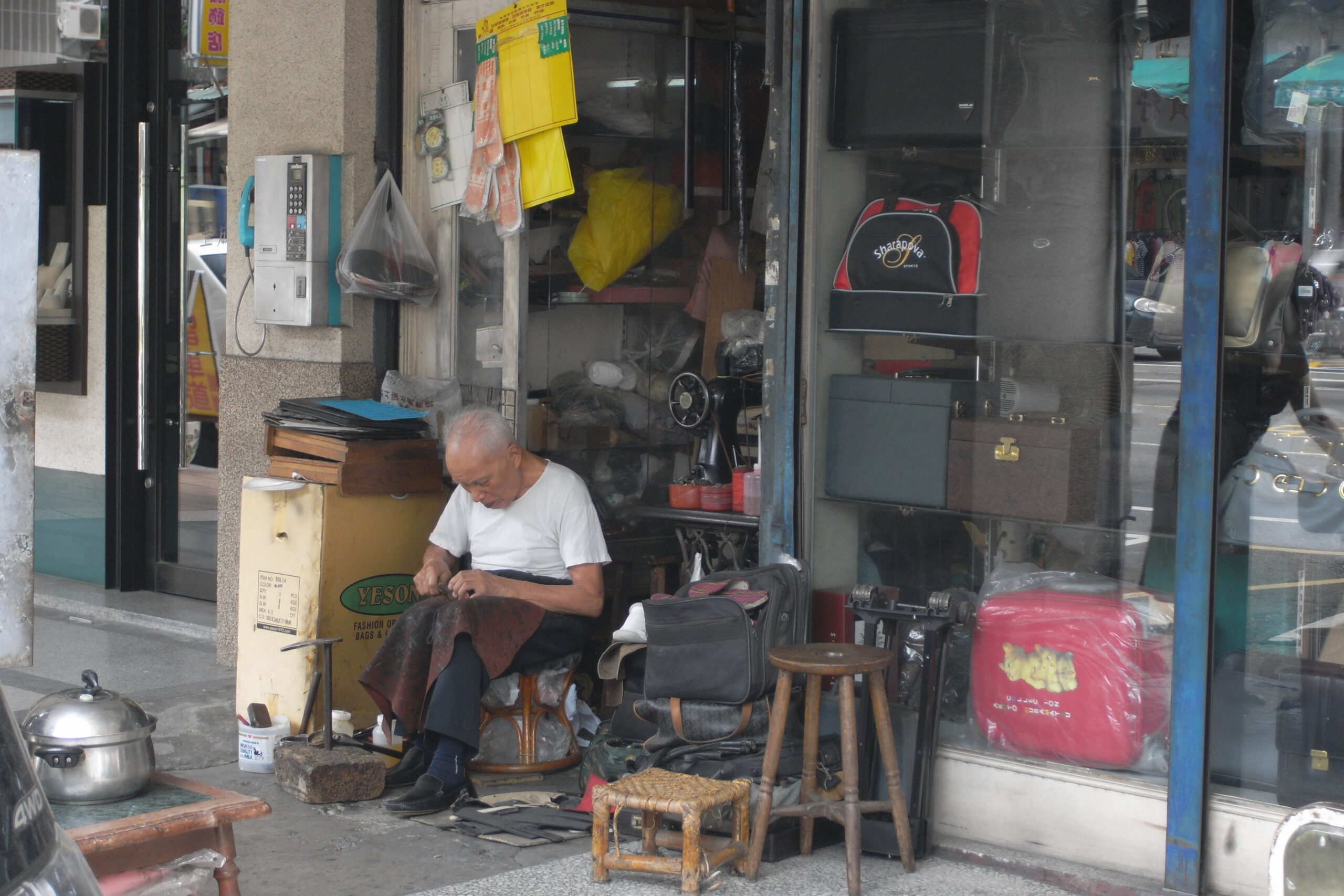 Customer carrying shopping bags in a retail street