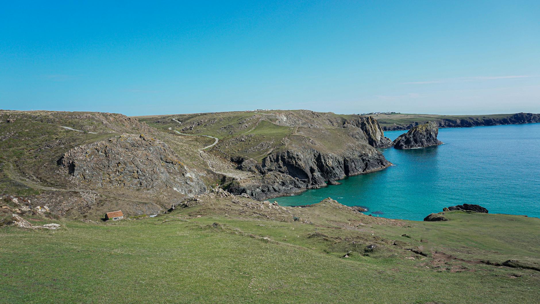 Dramatic coastal cliffs and turquoise sea in Cornwall