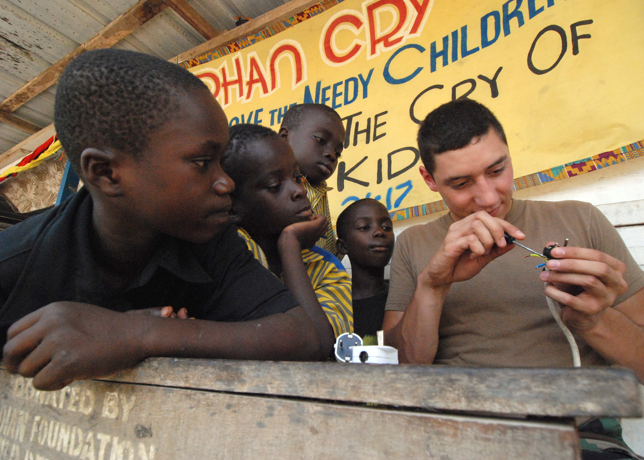 An electrician working on wiring and electrical fittings