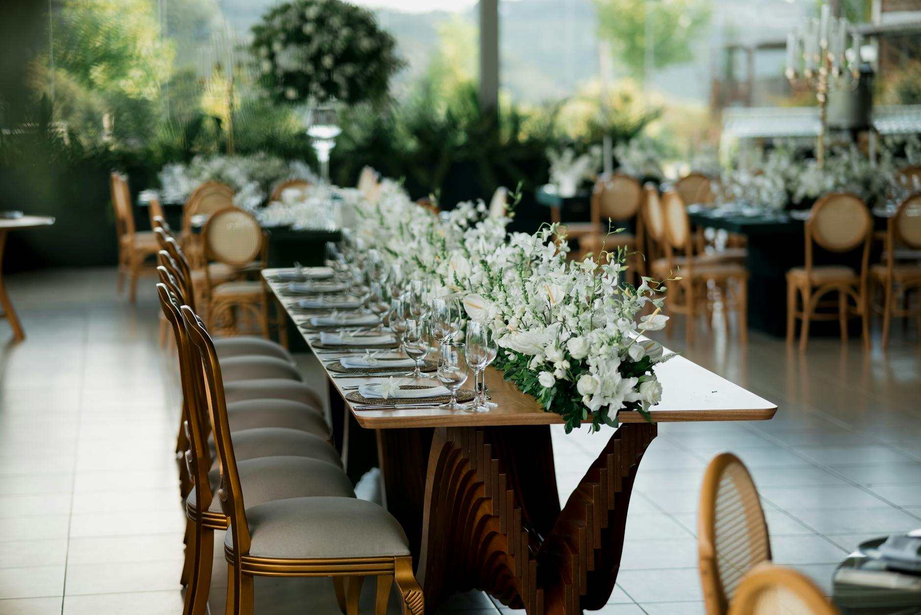 Elegant wedding reception table with candles and floral centrepieces