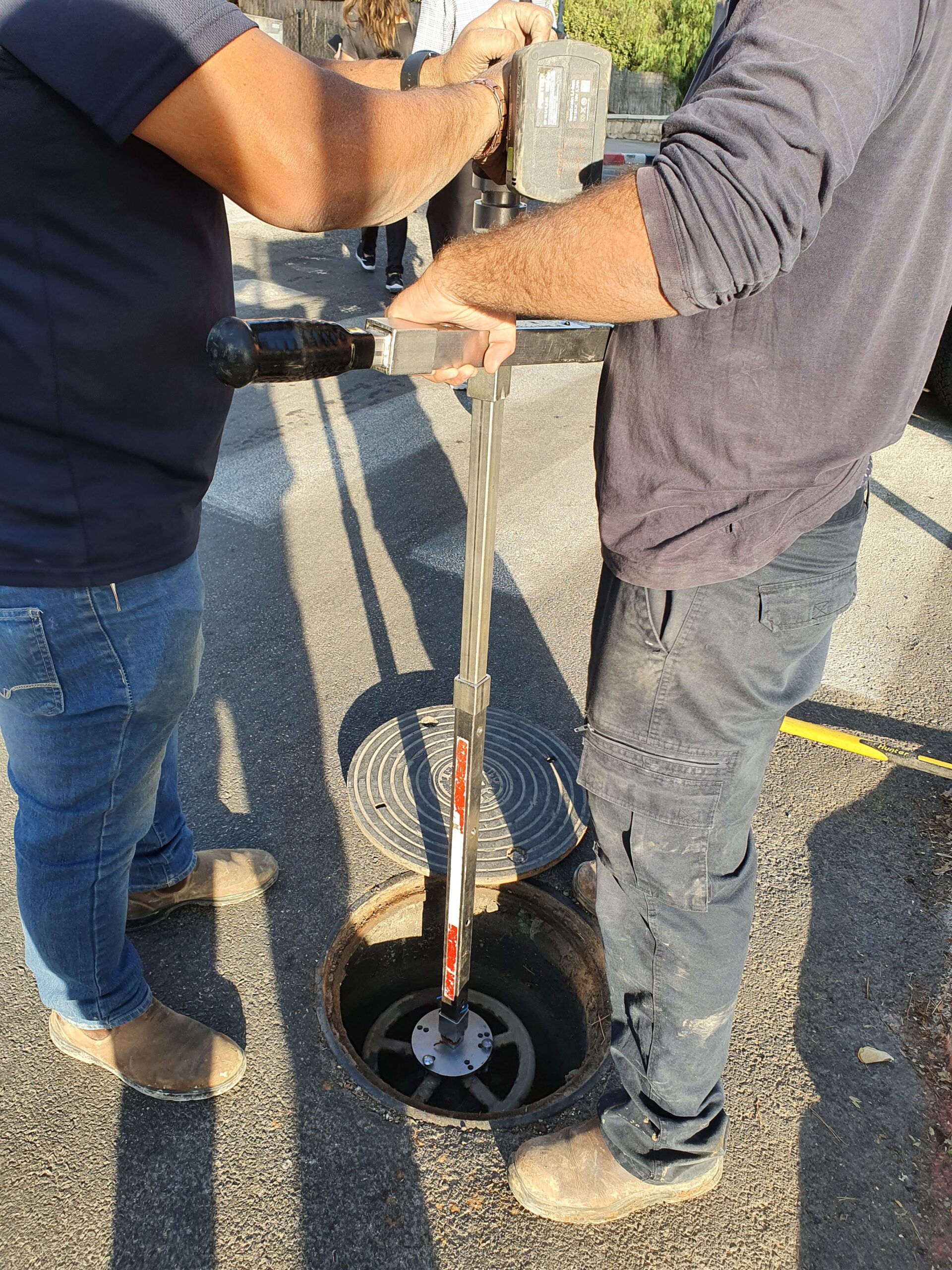 Plumber working on pipes with professional tools