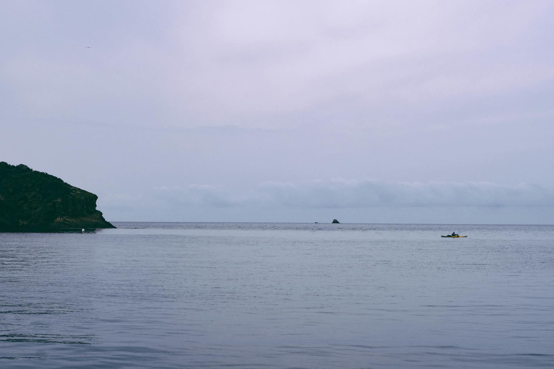 Sea kayakers paddling along the Cornwall coast