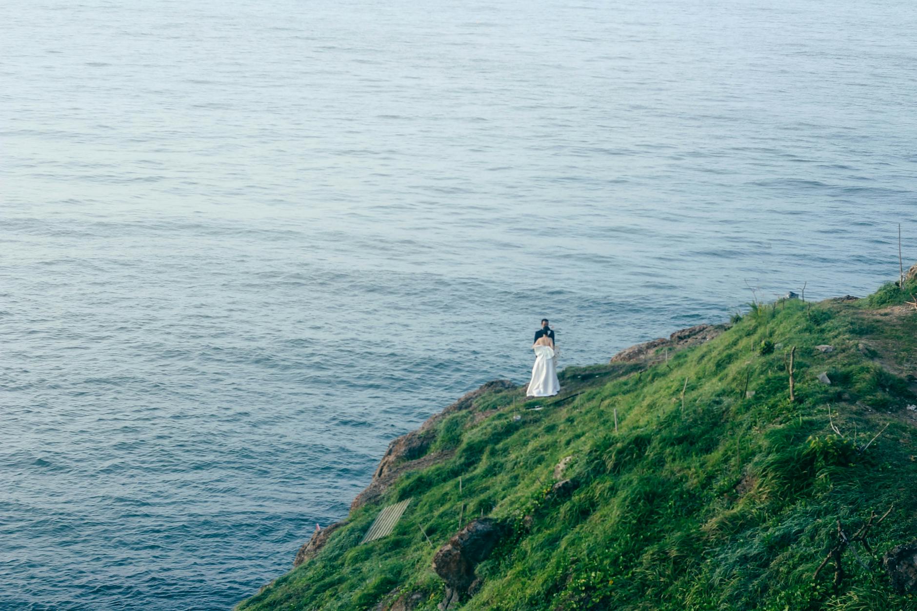 Bride and groom at a coastal cliff location in Cornwall