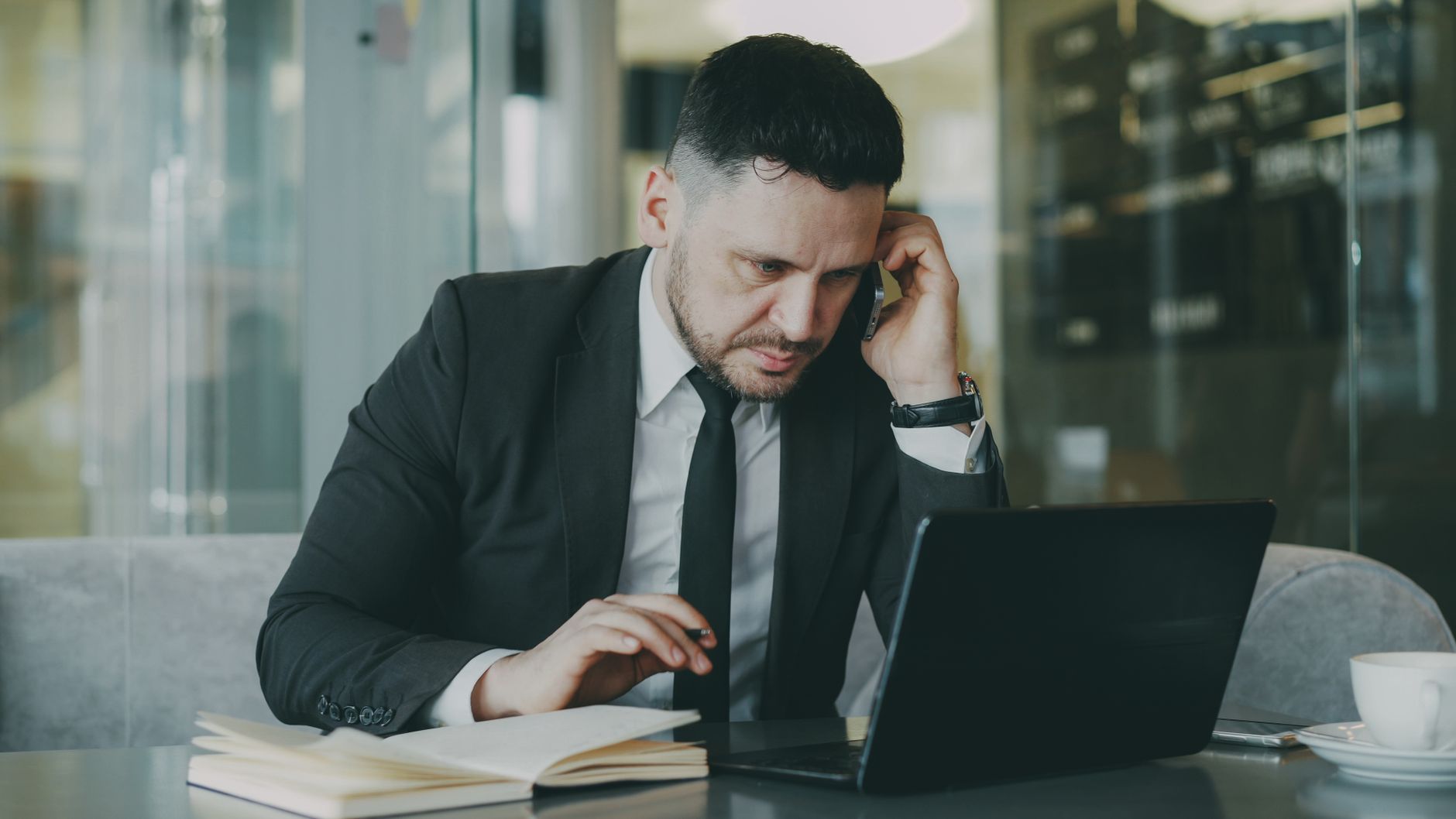 Cornwall business owner making decisions on a laptop