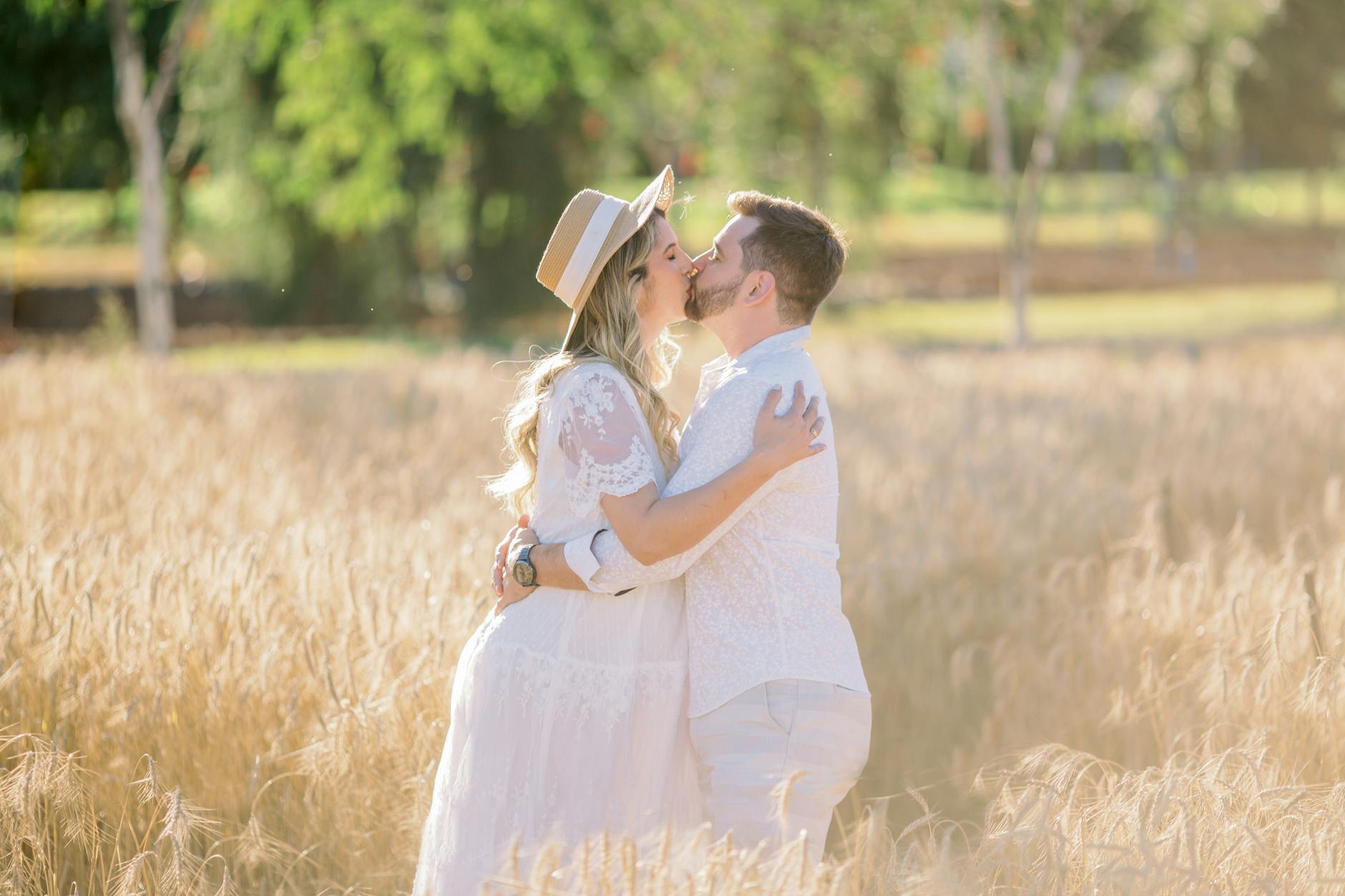 Couple during an outdoor engagement shoot in countryside fields
