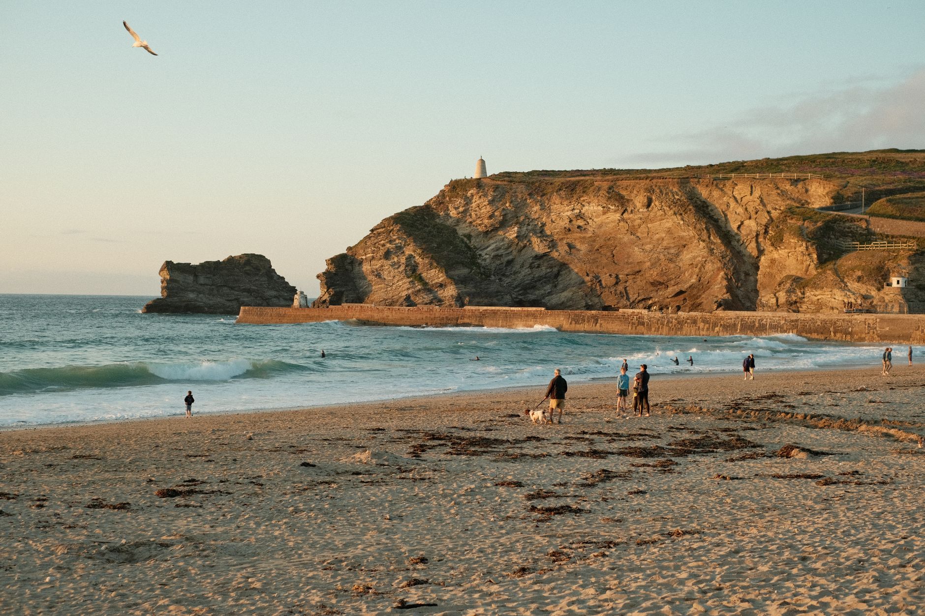 Family enjoying a camping holiday together in Cornwall during summer