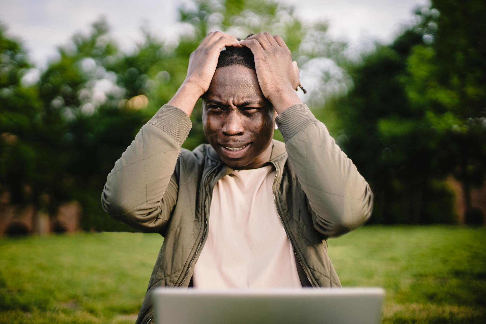 Person looking frustrated while searching on a laptop