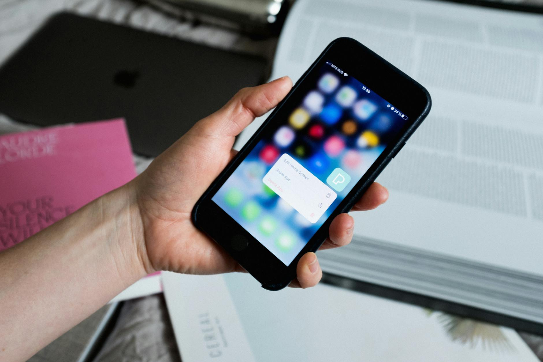 Person searching for camping and glamping accommodation on a mobile phone