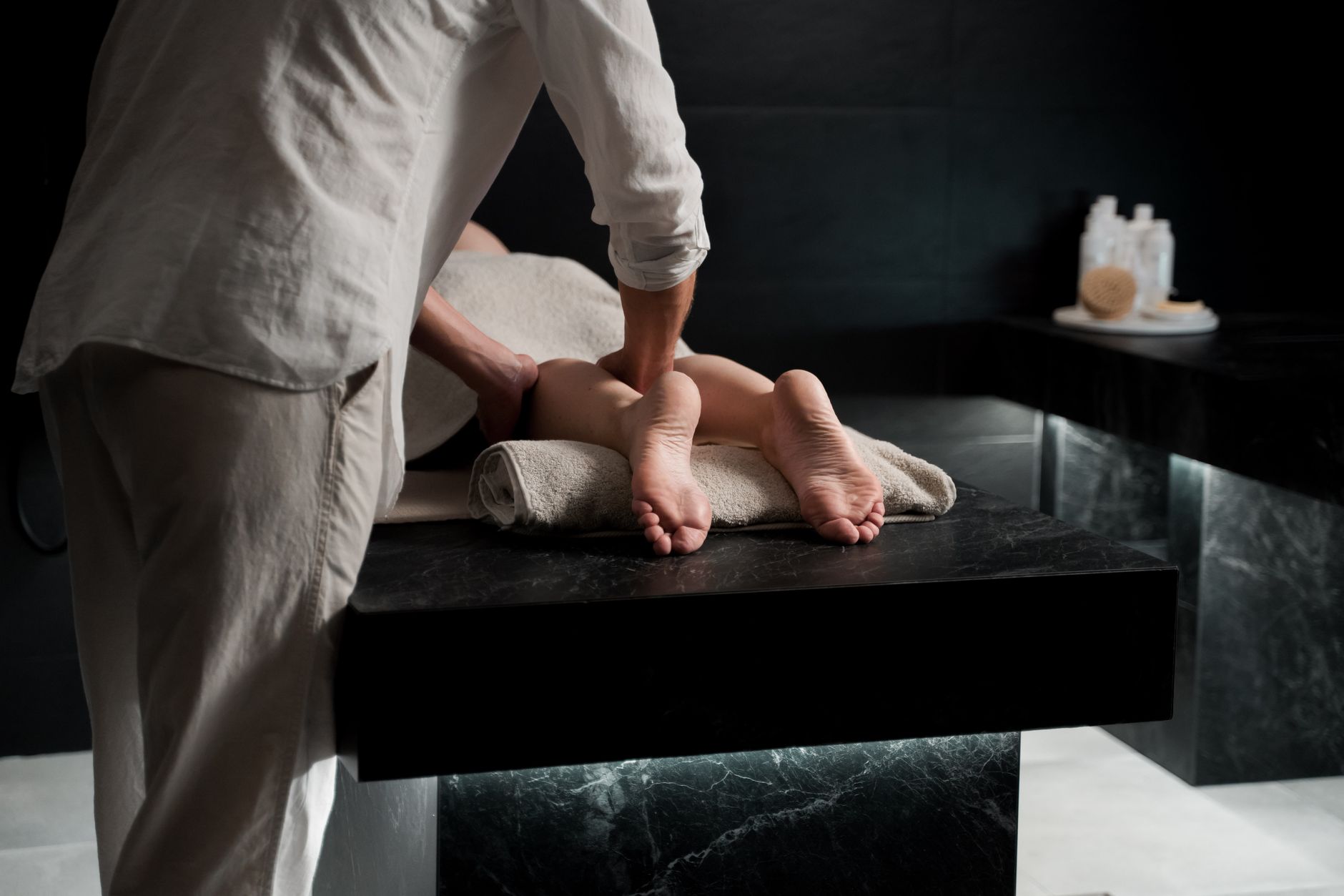 Relaxing massage therapy treatment room with soft lighting