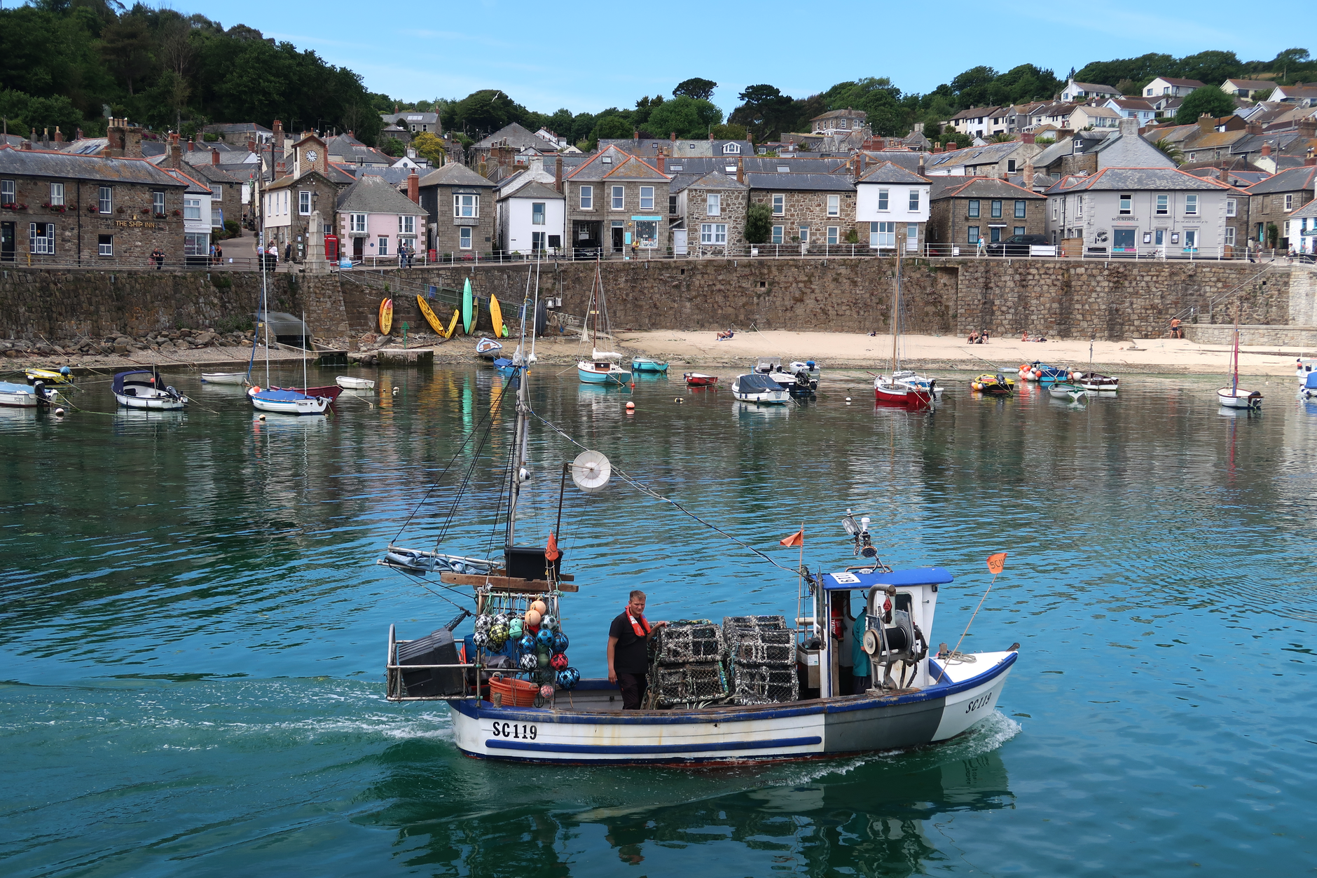 Boats moored in a Cornish coastal town harbour