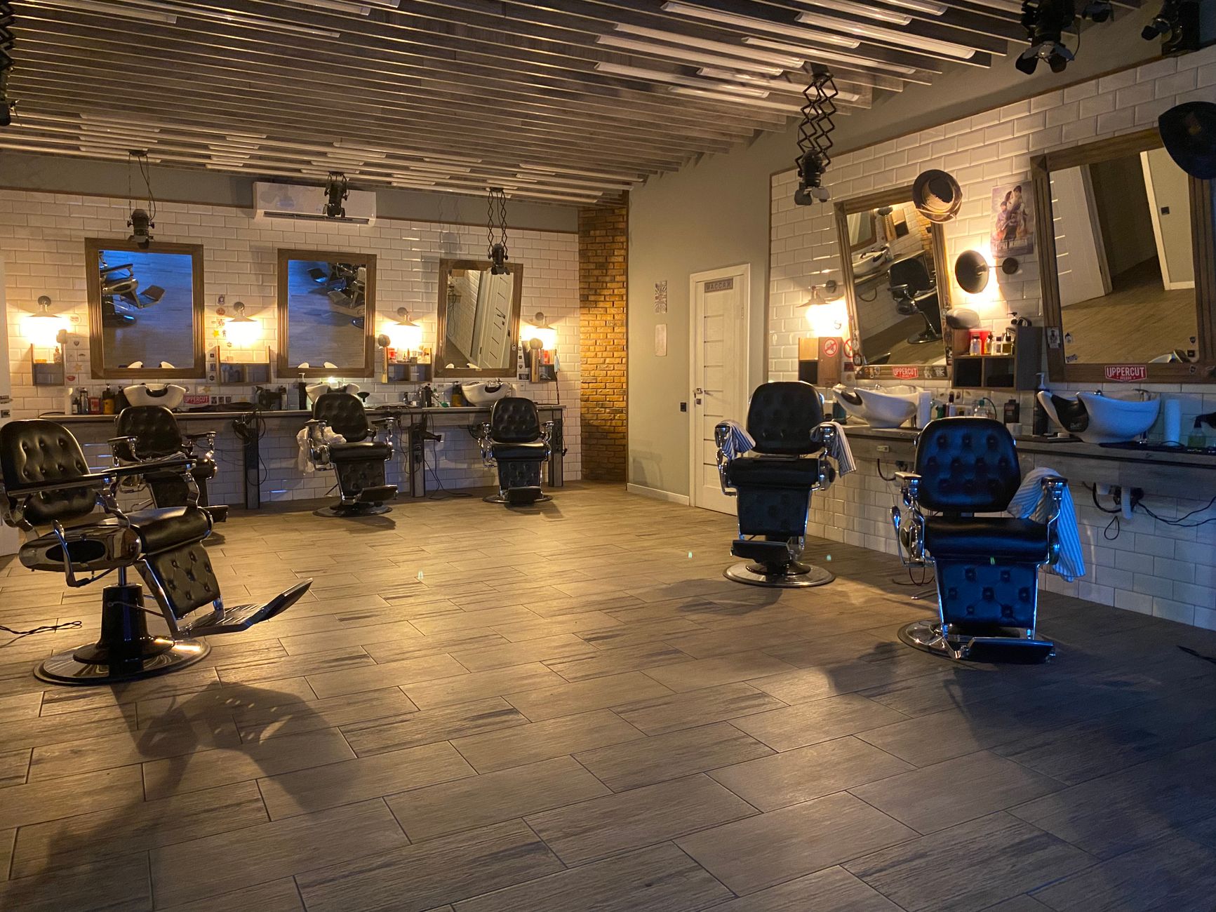 Bright hair salon interior with styling chairs and mirrors
