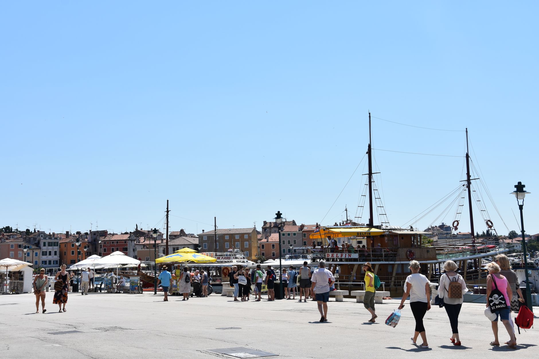 Busy seaside town street with summer tourists