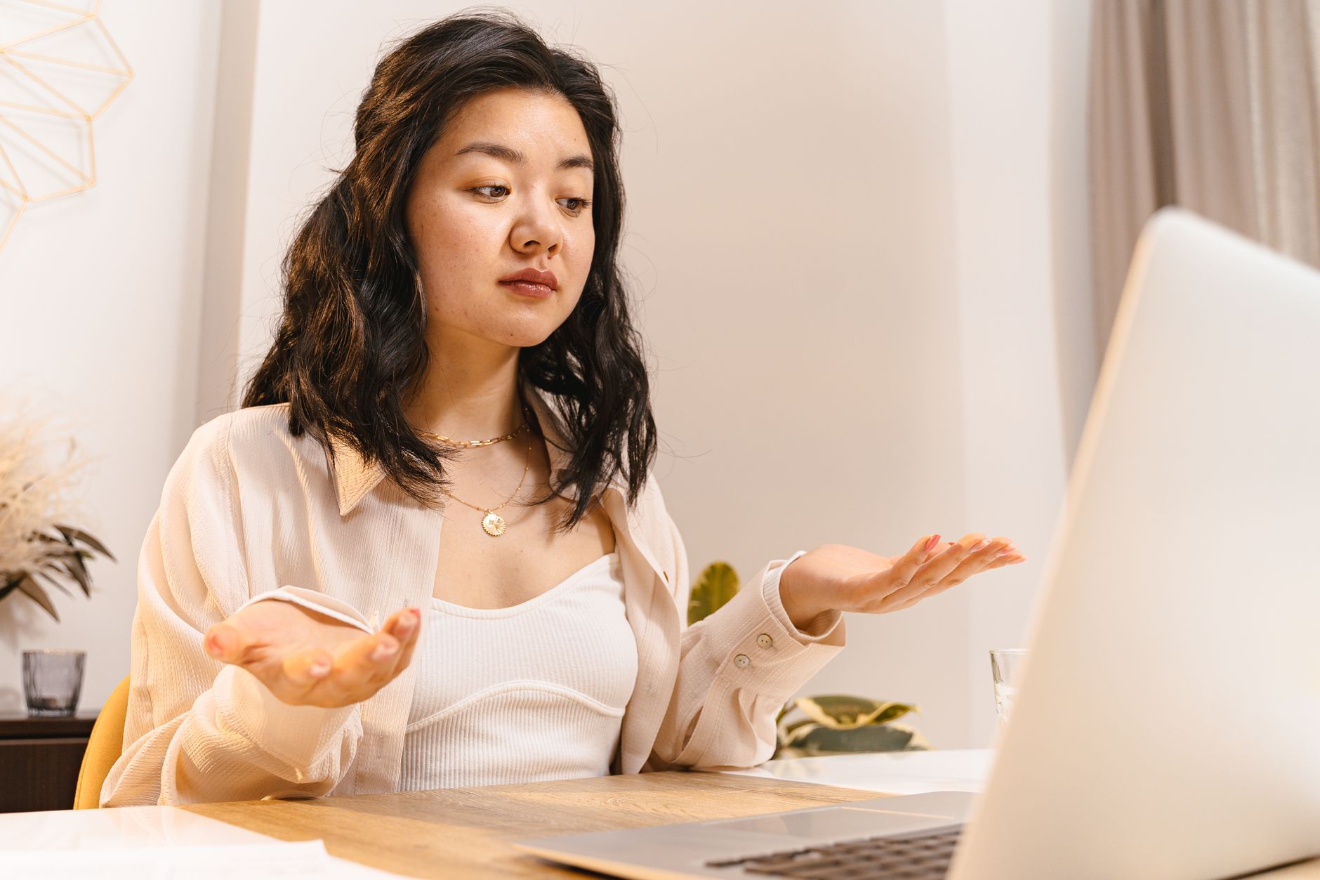 Cornwall business owner looking puzzled while reading about SEO on a laptop