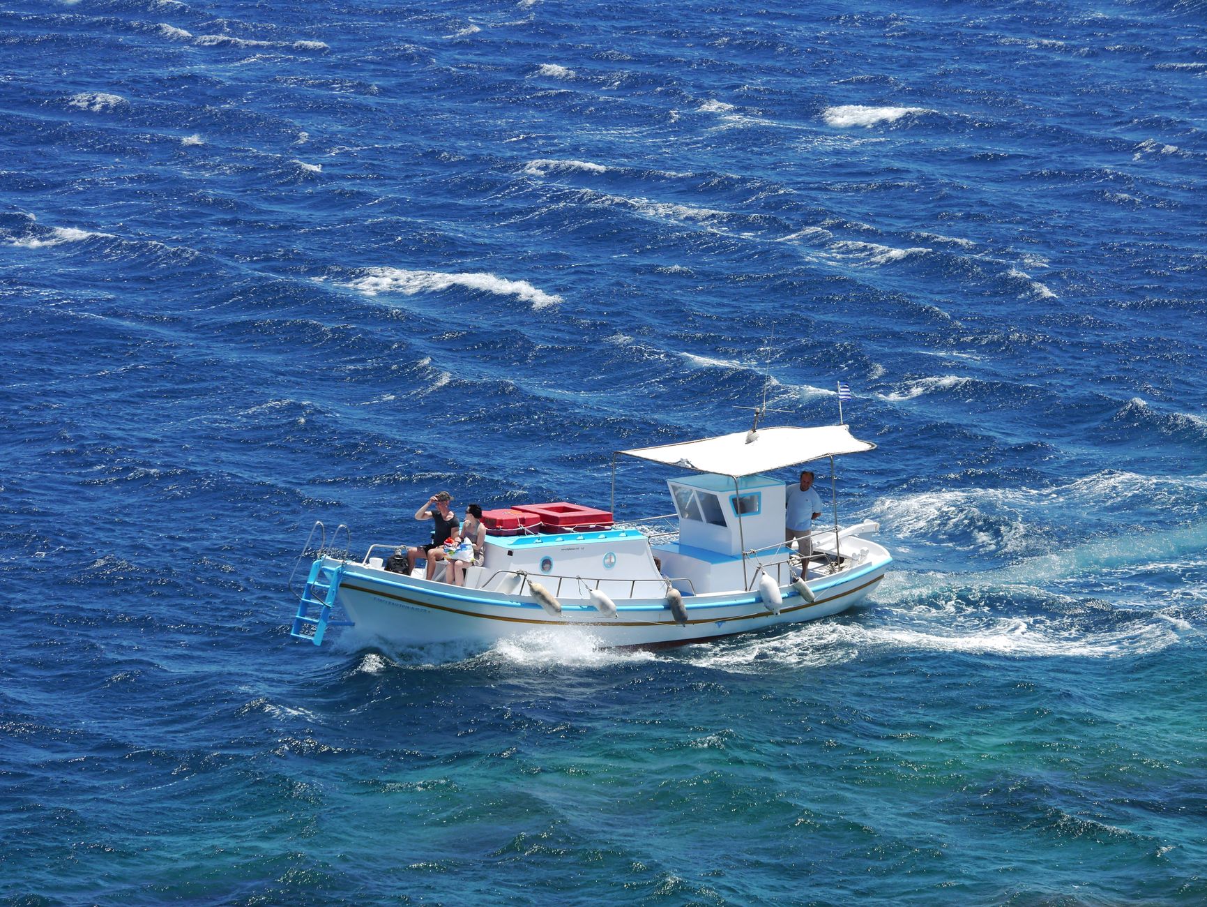Family enjoying a fishing trip on a charter boat at sea