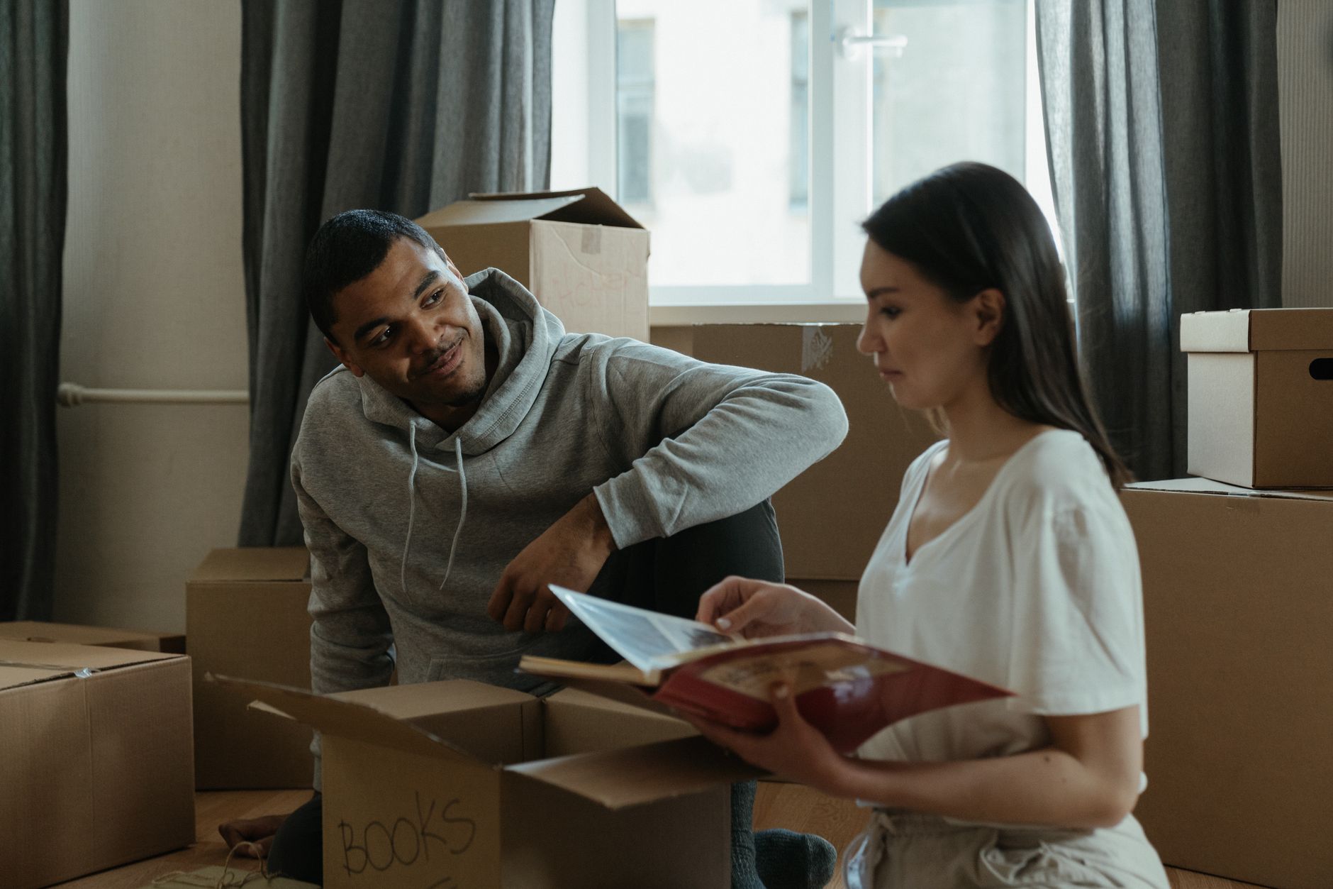 Family unpacking boxes in their new home