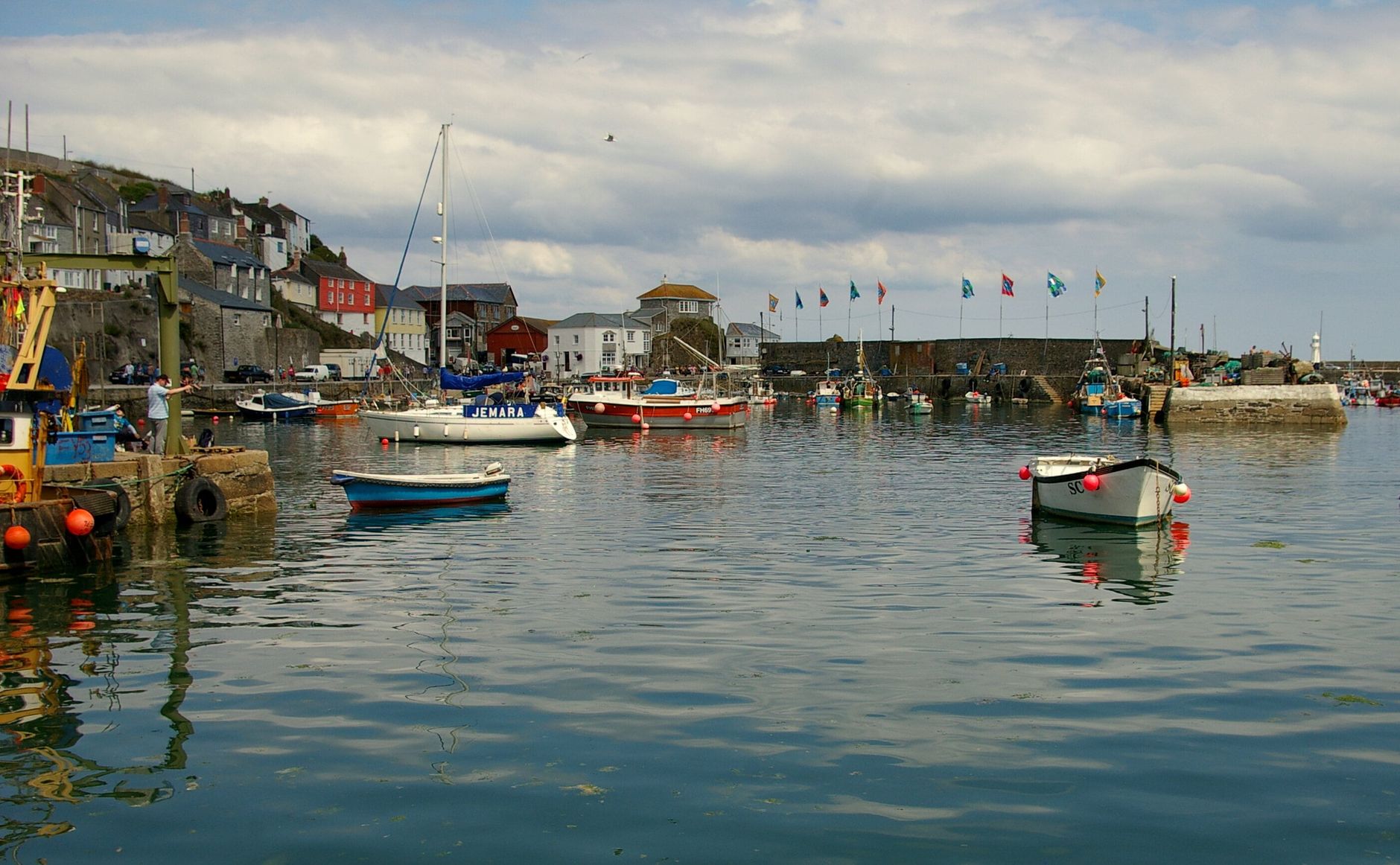 Fishing charter boat moored in a Cornwall harbour in the morning