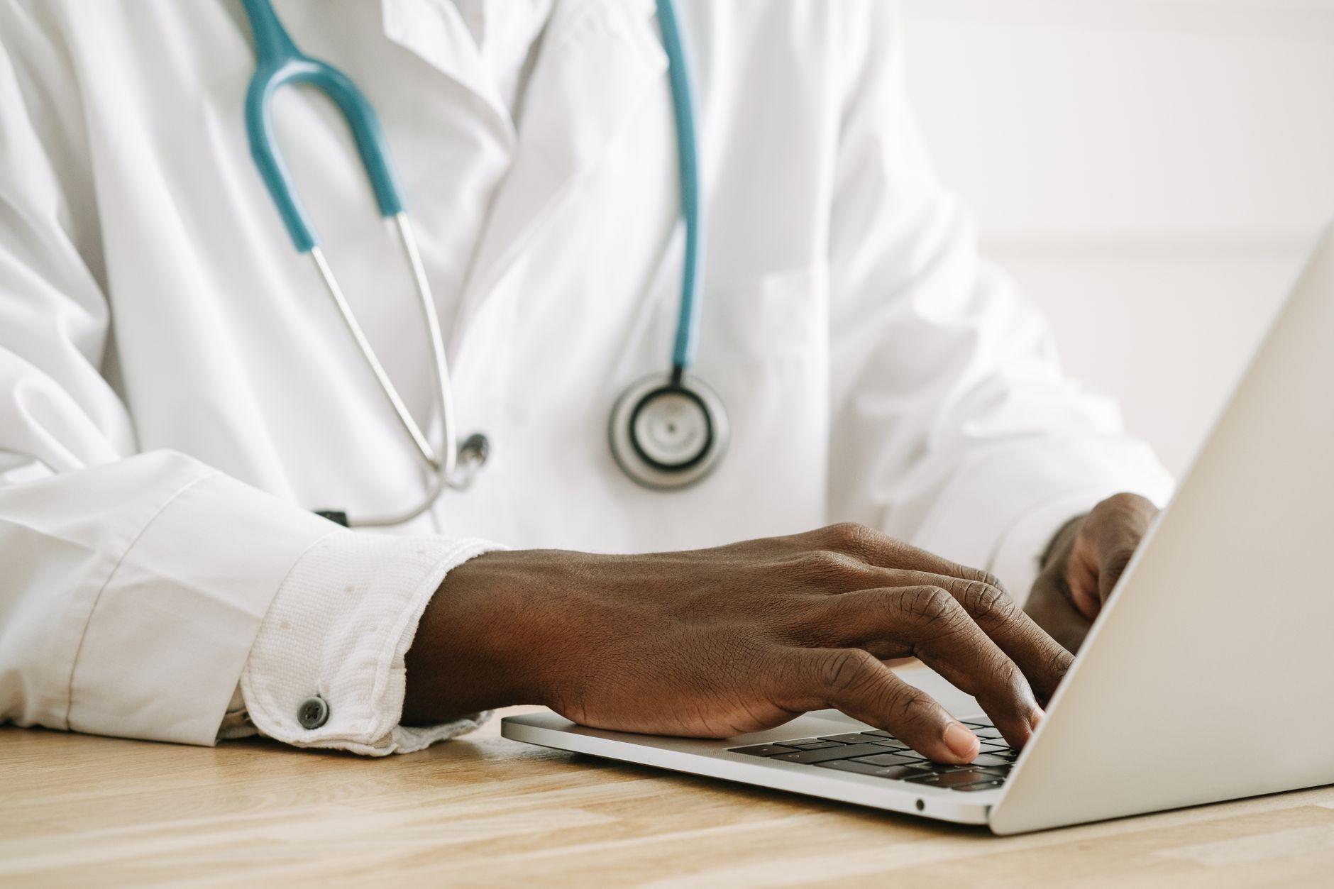 Patient reading online reviews on a laptop before booking
