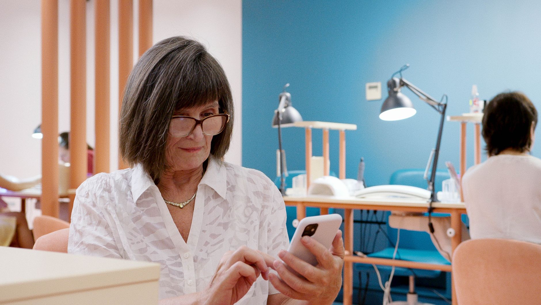 Person booking an appointment on a smartphone calendar