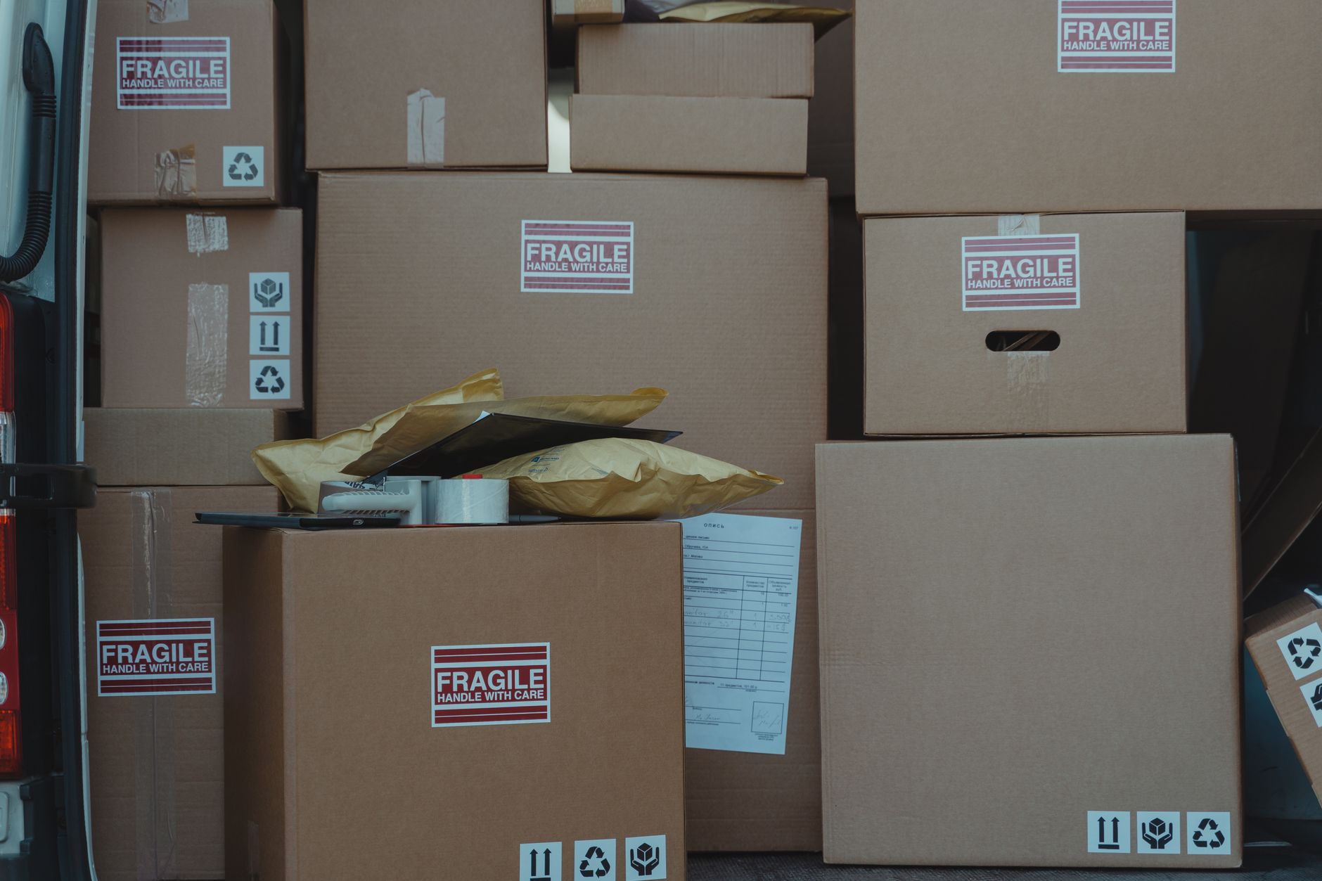 Removal van loaded with boxes on moving day