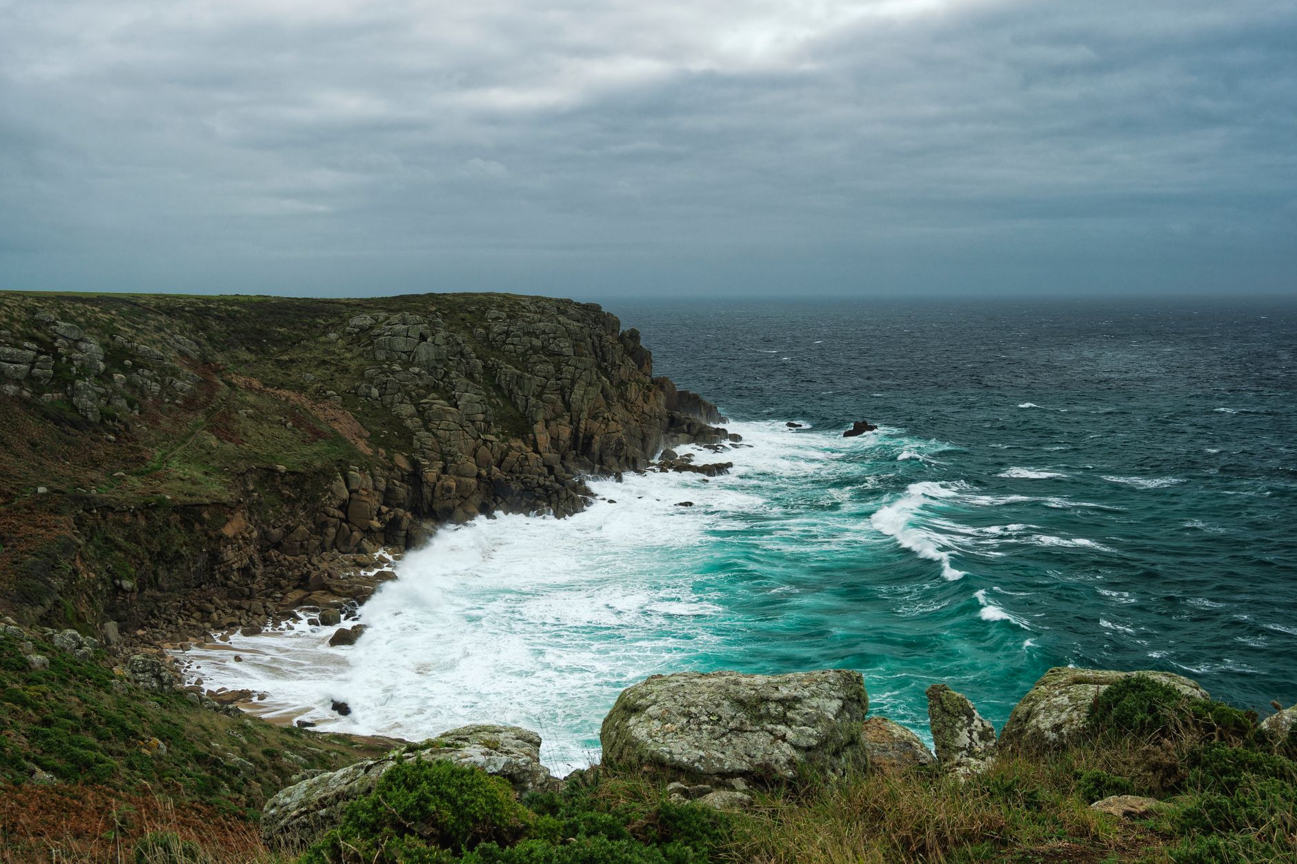 Stormy weather over the Cornish coast near a harbour
