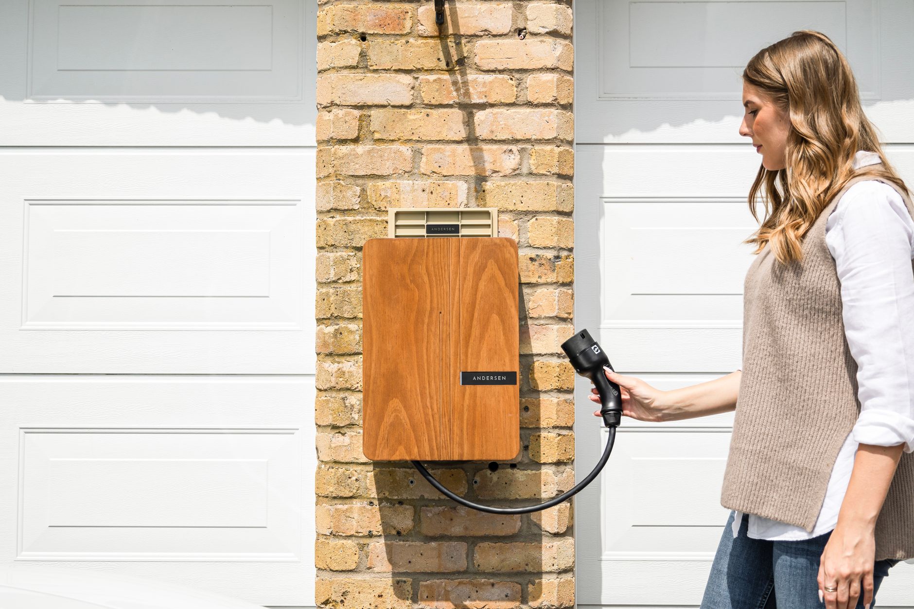 Electric vehicle charging on a home driveway charger